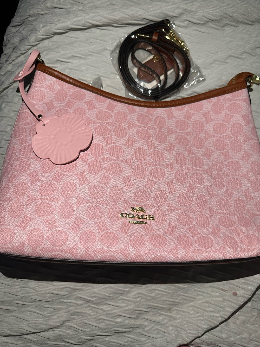 Coach Pink Signature Canvas Shoulder Bag with Flower Charm and Brown Trim. - Picture 1 of 3
